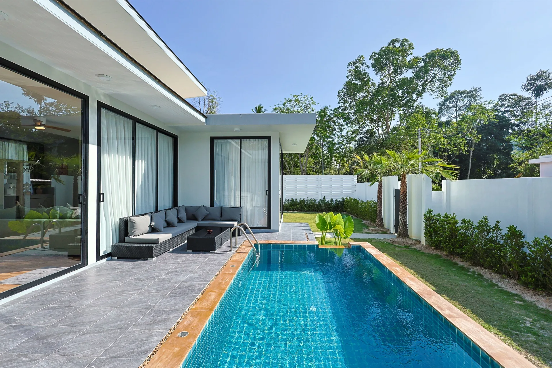 View from inside the villa out to the pool and terrace